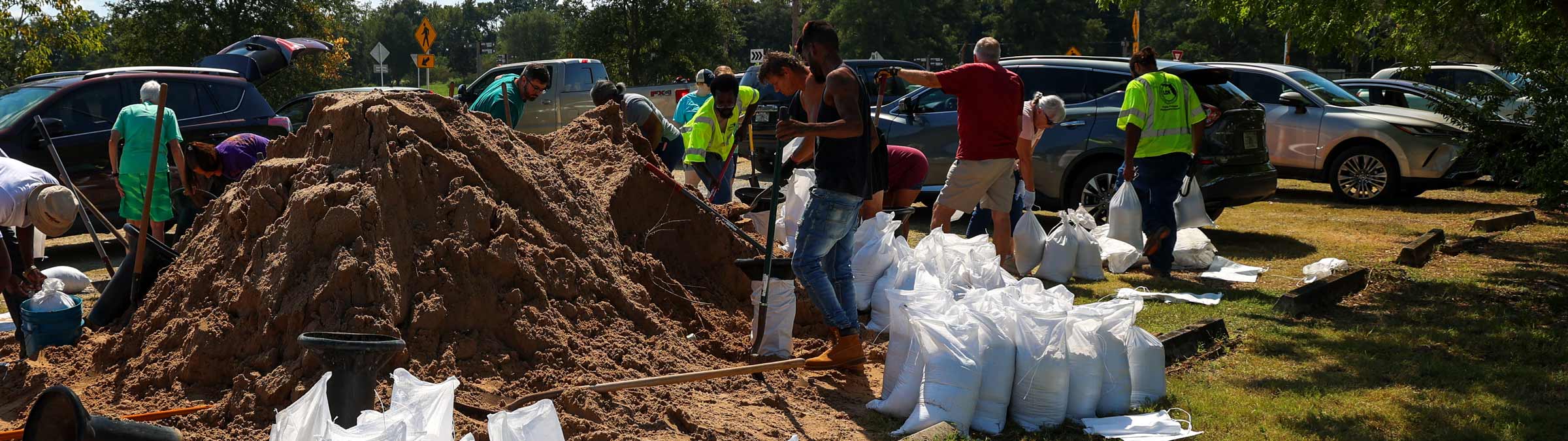 Photo of people filling sandbags